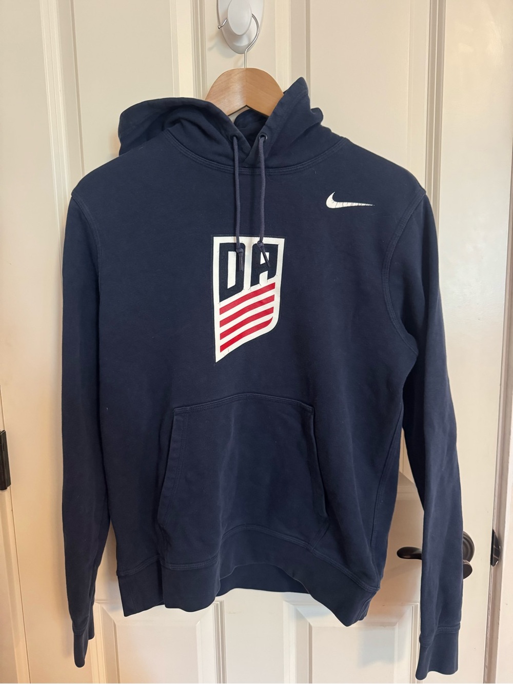 Nike Navy Hoodie with White Swoosh and Red Accent Shield